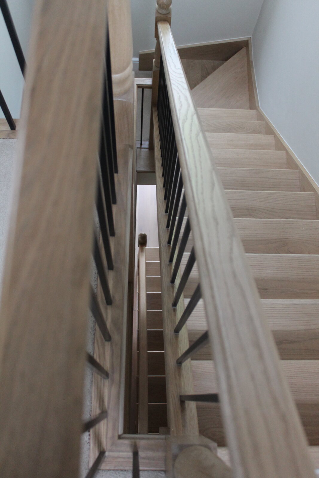 Oak staircase and dark spindles at Bare Hills View
